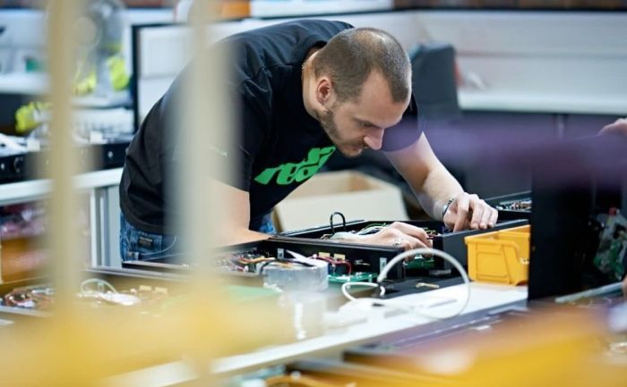 Rega employee at the Rega factory