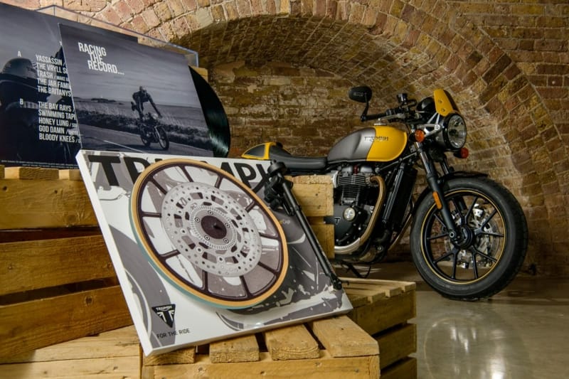 Rega Triumph turntable with ‘Recing the Record’ vinyl and Triumph Street Cup motorcycle