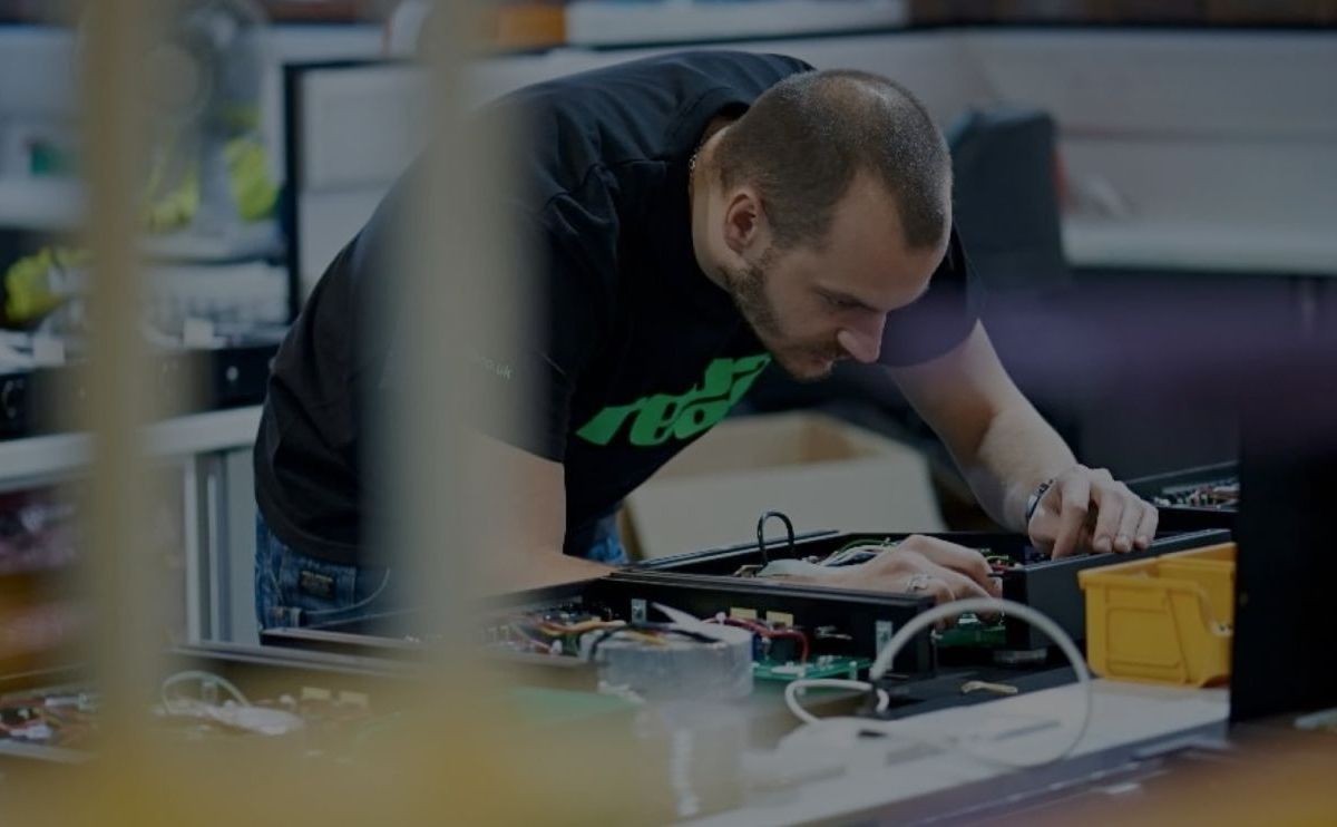 A Rega employee hard at work in the factory.