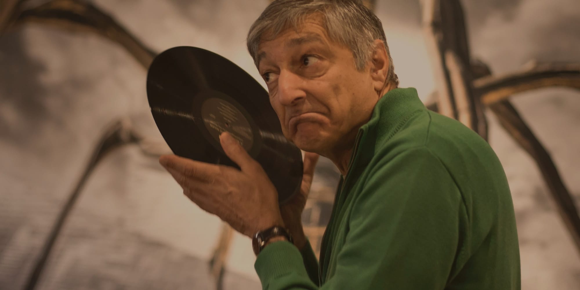 Roy Gandy listening (quite literally) to a record.